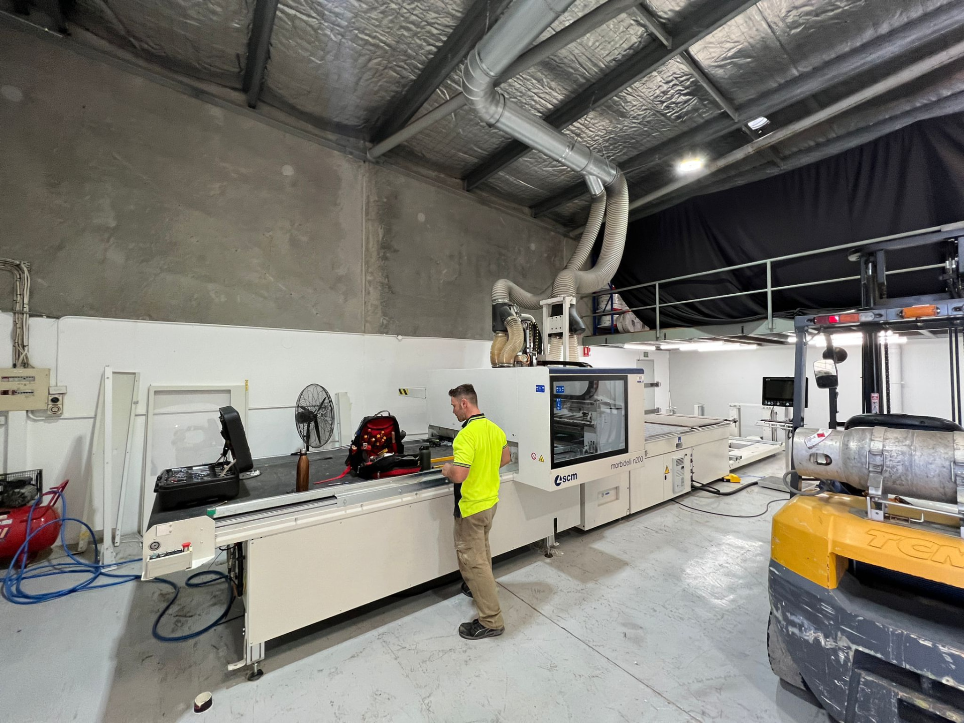 MBTES technician servicing an SCM Morbidelli n200 CNC machining centre